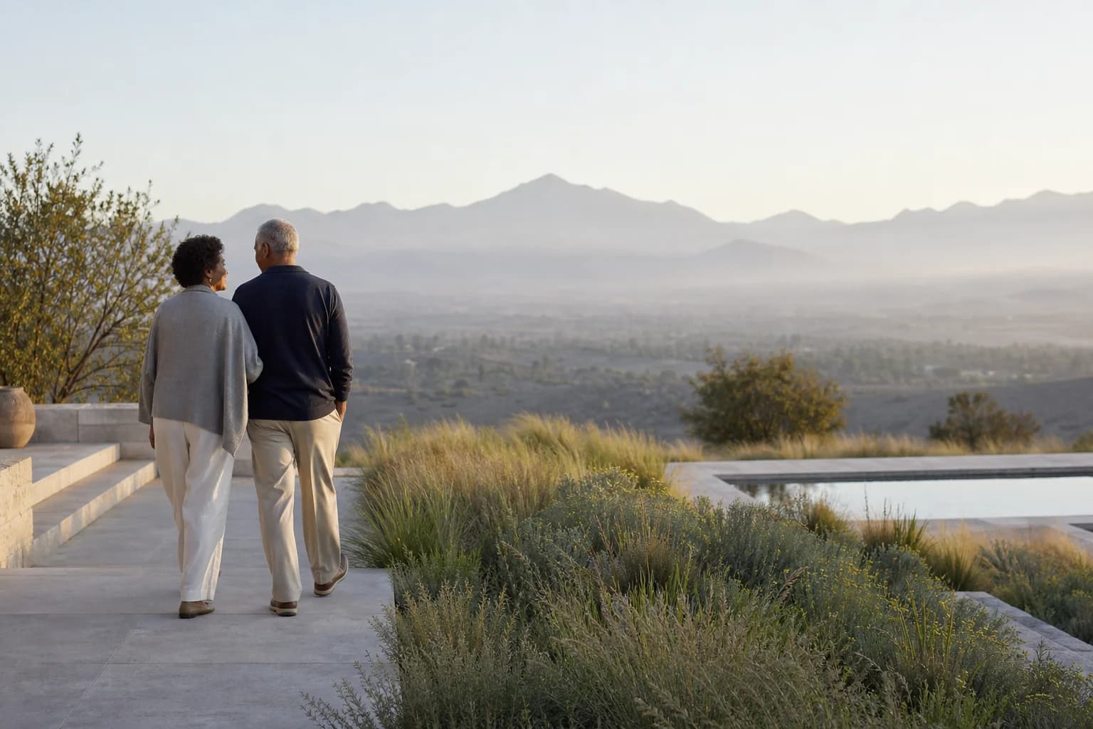 A couple looking toward a peaceful mountain landscape